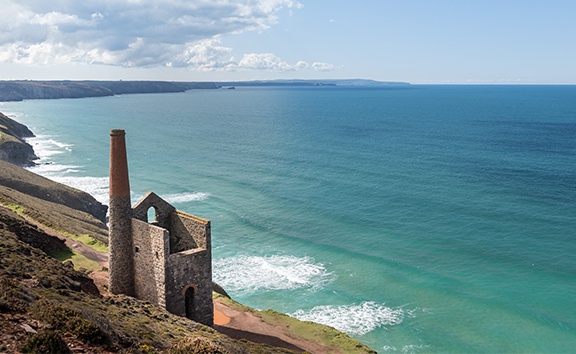 Cornish coast with old stone building